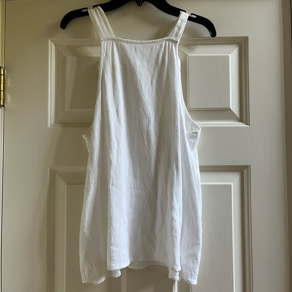 White tank top with knots at the end of the straps